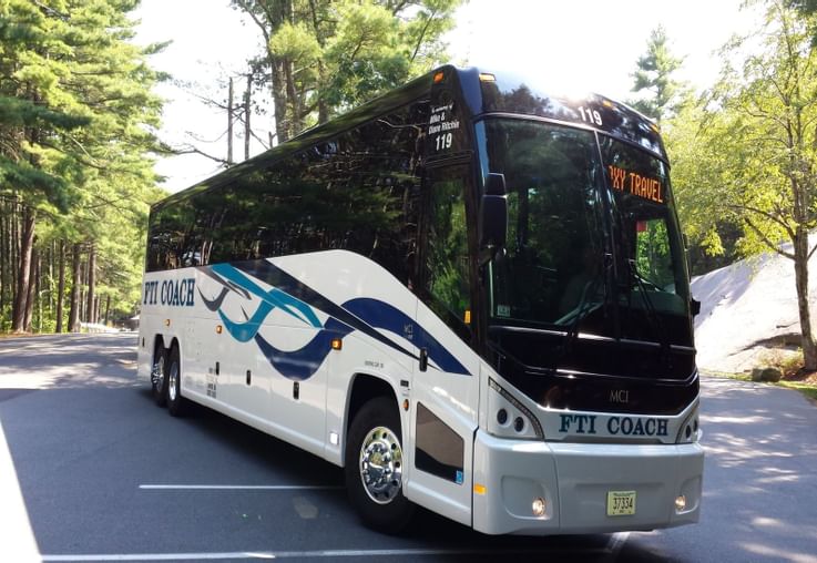Tour group unloading a motorcoach at a hotel with a negotiated group rate