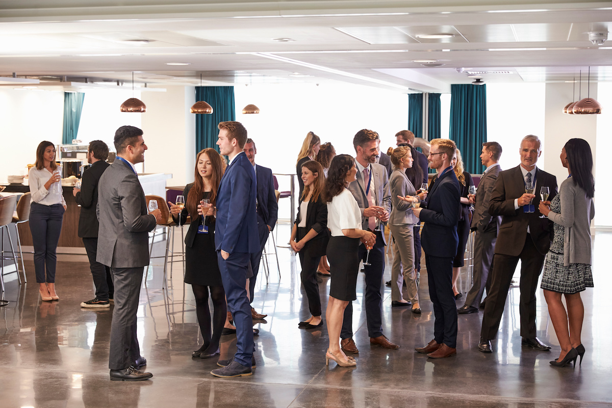 Conference attendees networking at their hotel between sessions