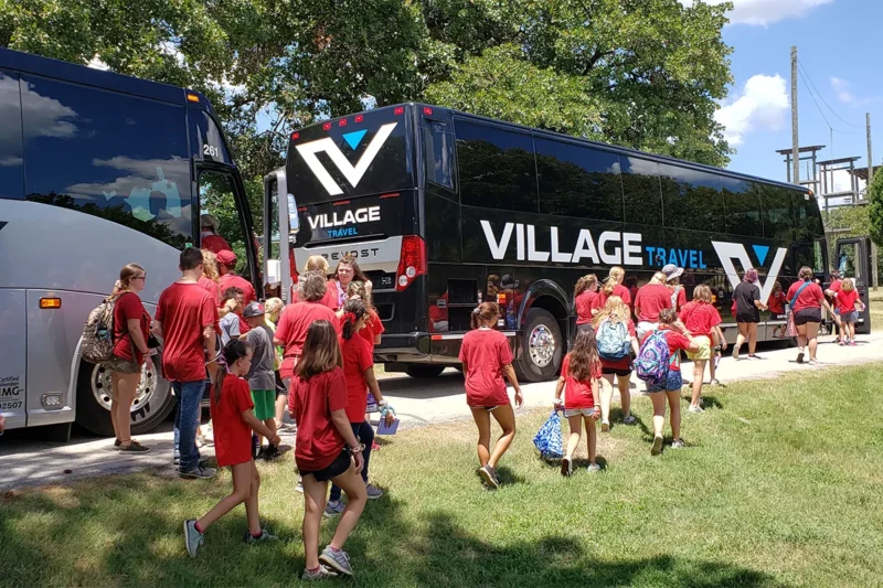 Church choir group checking into a tour hotel with bus parking