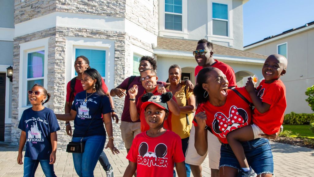 Multigenerational family arriving at a hotel with a family reunion room block